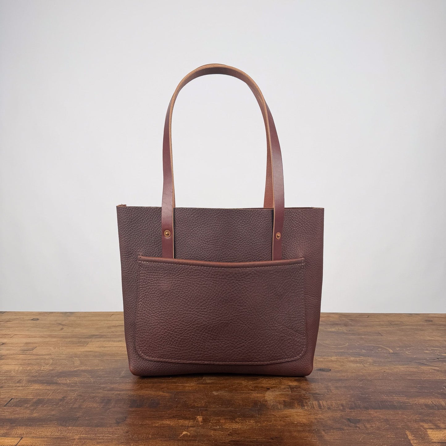 AVERY LEATHER TOTE BAG - SMALL - DARK SADDLE - LARGE FRONT POCKET - TWO LOOSE INSIDE POCKETS - IN STOCK