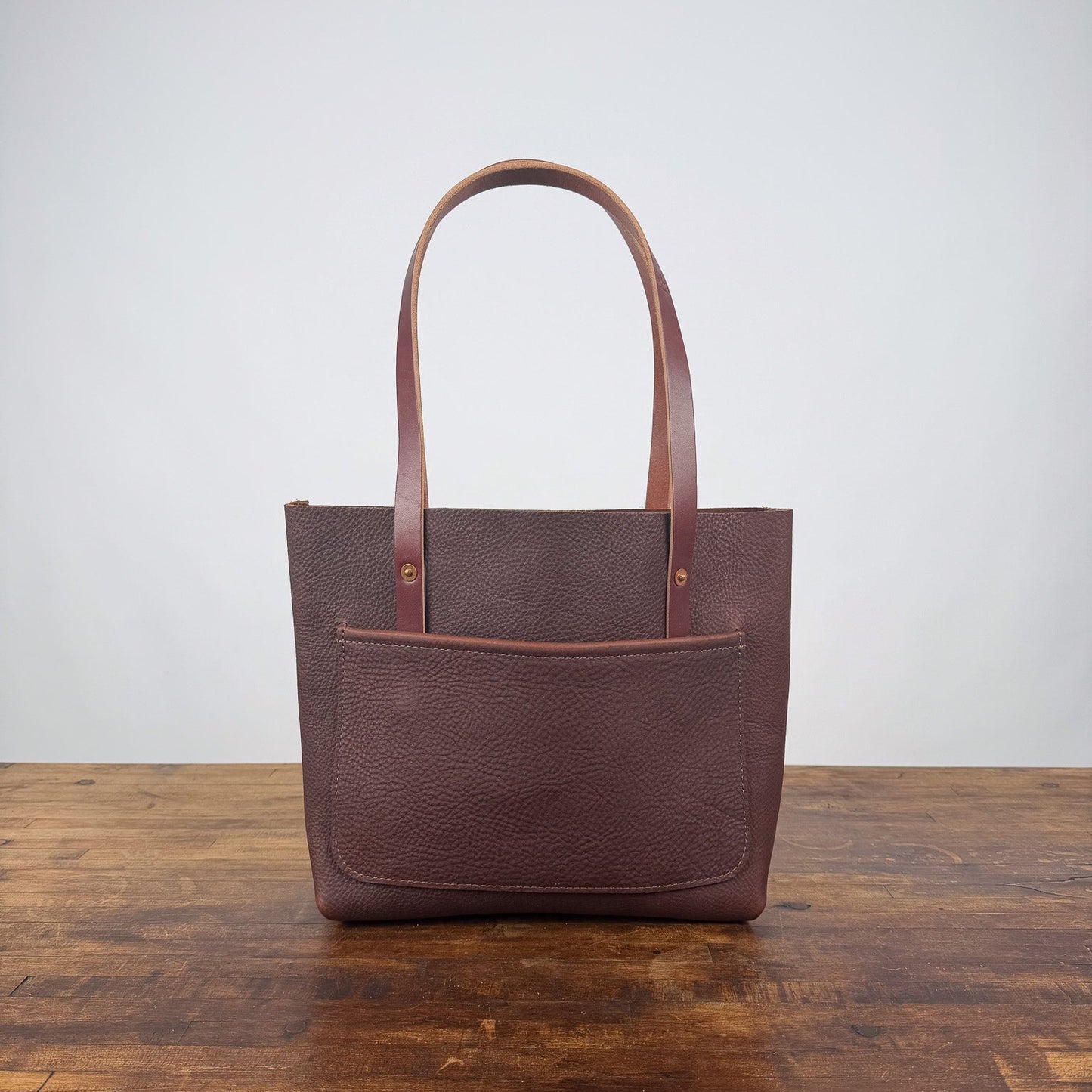 AVERY LEATHER TOTE BAG - SMALL - DARK SADDLE - LARGE FRONT POCKET - TWO LOOSE INSIDE POCKETS - IN STOCK