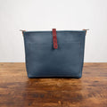 AVERY CROSSBODY - SMALL - SMOKEY BLUE - SADDLE STRAPS - LARGE FRONT POCKET - HEMMED TOP - BUTTON STUD - IN STOCK